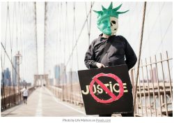 skeleton holding a sign